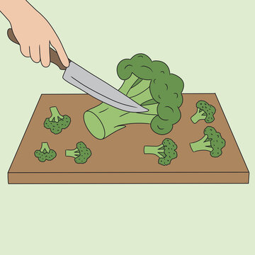Raw vegan broccoli preparation on cutting board with knife