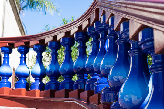 Traditional blue glazed railing under curved wooden eave