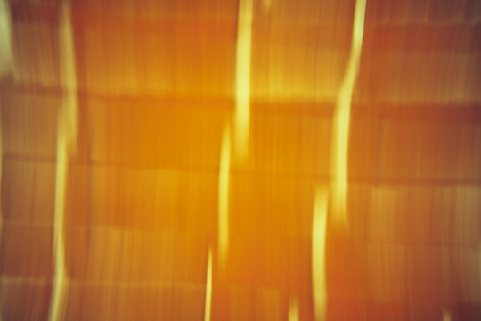 Abstract orange motion blur background with glowing lines