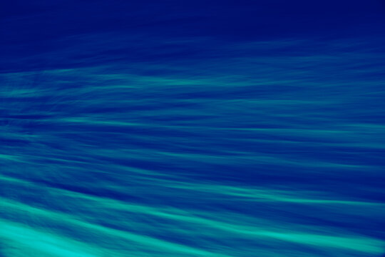 Abstract blue motion background with flowing light streak