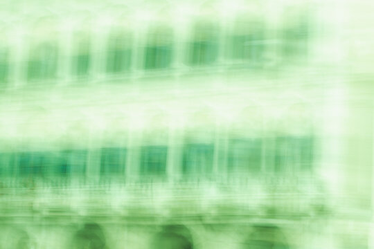 Soft green abstract motion blur background with gentle grid