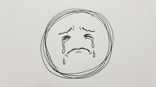 Sad face drawing with tears crying inside a circle.