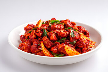Fototapeta premium Classic Korean Dak Galbi Dish Served on a Full Plate with Colorful Ingredients and Garnishes