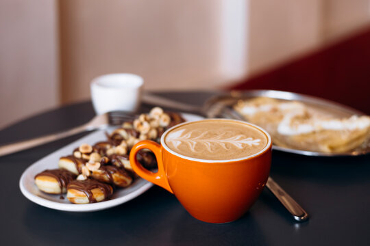 Breakfast coffee with mini pancakes, apple pancake and cream