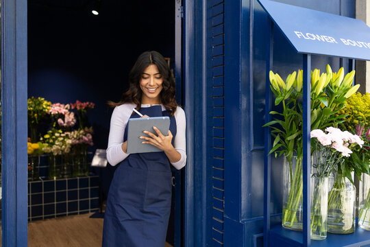 Florist working in a blue flower shop