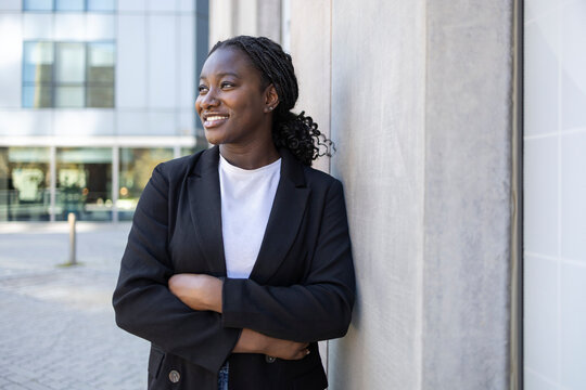 Confident African businesswoman Smiling outdoors by office