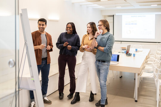 Team brainstorming in a modern coworking office meeting