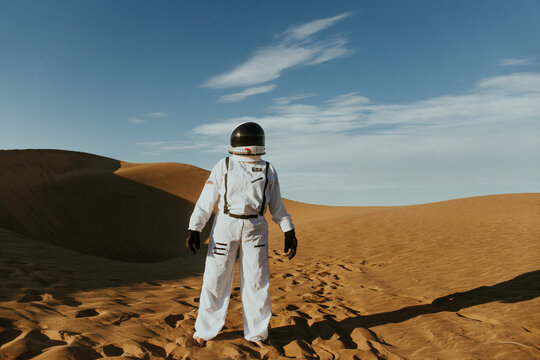Astronaut exploring sandy landscape in Chile