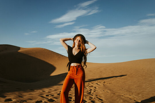 Woman enjoying sunny day in Concon Dunes, Chile