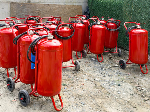 Group of portable fire extinguishers on construction site