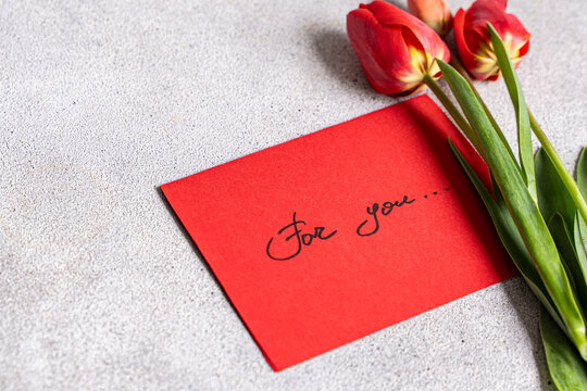 Red card with tulips and handwritten message