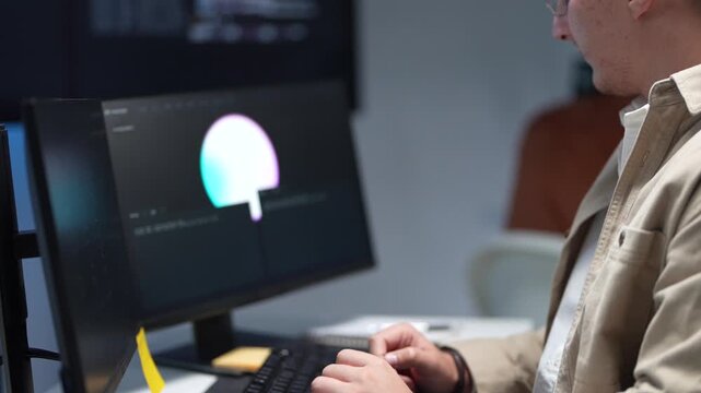 Close up of a technology developer hand pointing a stylus at a computer screen to debug machine learning scripts and artificial intelligence logic.