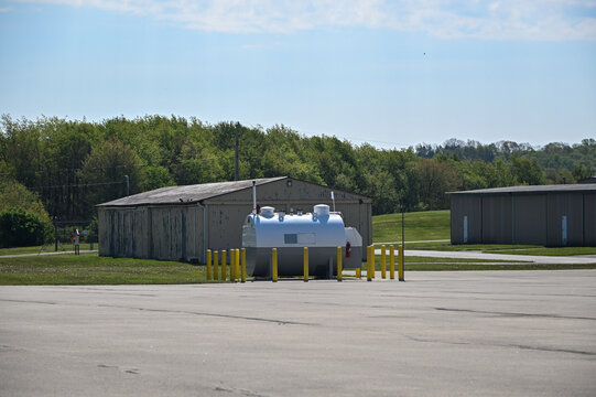Airport hangar with fuel tank outside