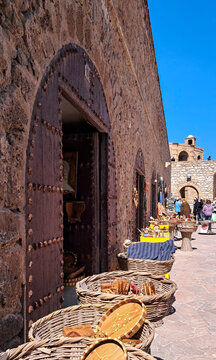 Handcrafted wooden souvenirs displayed in front of a shop in the medina of Essaouira.