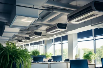 Contemporary open plan office showing hvac units, ventilation ducts, and green plants © nsit0108