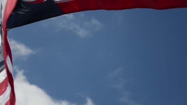 Betsy Ross American Flag Star Spangled Banner flying in strong breeze at high angle