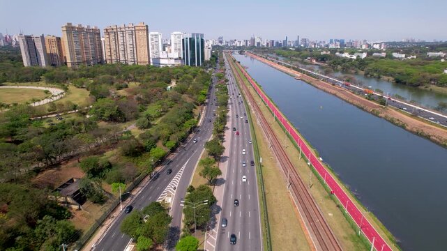 SAO PAULO, BRAZIL - MAY 2026: Aerial view of the Octavio Frias de Oliveira cable-stayed bridge and Marginal Pinheiros highway with river reflection.