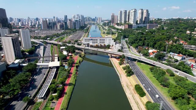SAO PAULO, BRAZIL - MAY 2026: Aerial view of the Marginal Pinheiros highway with river reflection.