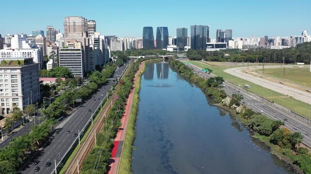 SAO PAULO, BRAZIL - MAY 2026: Aerial view of the Marginal Pinheiros highway with river reflection.