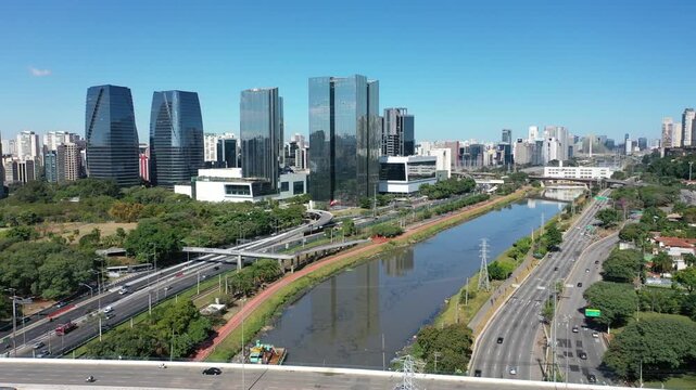 SAO PAULO, BRAZIL - MAY 2026: Aerial view of the Marginal Pinheiros highway with river reflection.