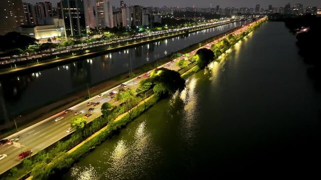 SAO PAULO, BRAZIL - MAY 2026: Aerial view of the Marginal Pinheiros highway with river reflection.