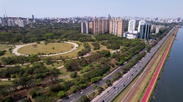 SAO PAULO, BRAZIL - MAY 2026: Aerial view of the Octavio Frias de Oliveira cable-stayed bridge and Marginal Pinheiros highway with river reflection.