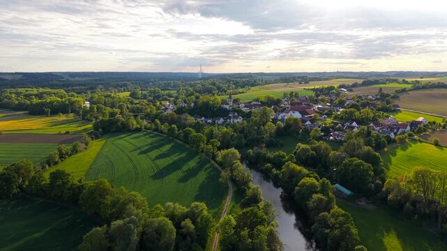 Scenic aerial panorama of Inkofen, Freising district, Germany, with Katholische Filialkirche St. Michael Inkofen and the Amper River in summer light.