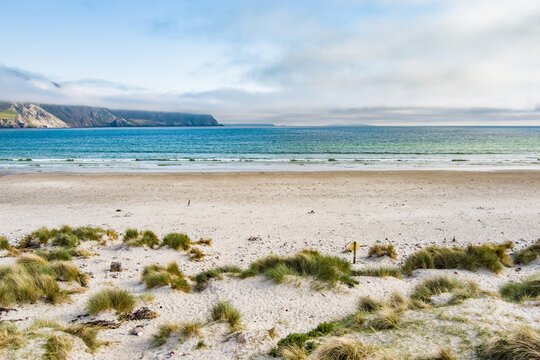 Aerial view of Keel Beach on Achill Island, County Mayo, Ireland. Turquoise Atlantic water, white sand and low cloud along the Wild Atlantic Way.