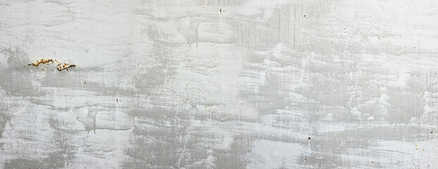 Plakat Iron wall with faded light gray paint, old and rusty. Gray rusty grunge metal texture with social media style filter. Horizontal vintage. Traces of runoff paint, a chaotically painted metal surface.