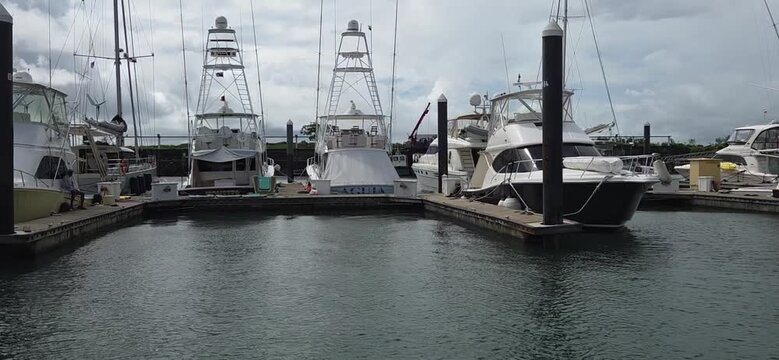 A group of boats and boats docked in the Yapes Bay of Amador Panama