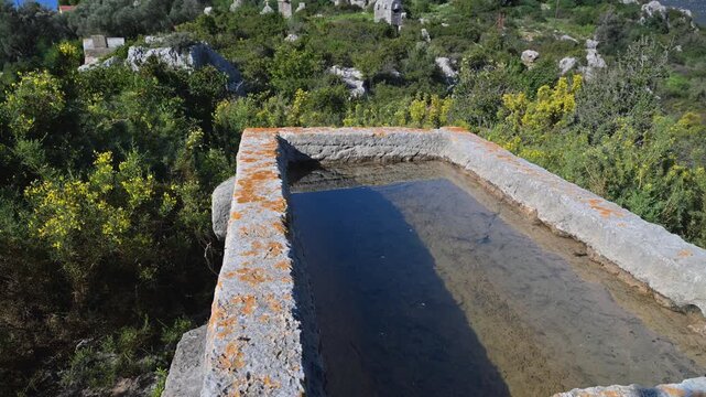 Ancient Lycian sarcophagus revealing Simena Castle in Turkey