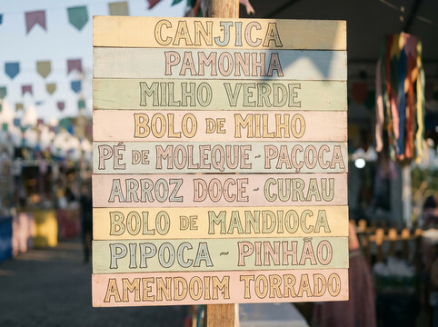 Vertical Colorful Wooden Signpost Listing June Festival Menu