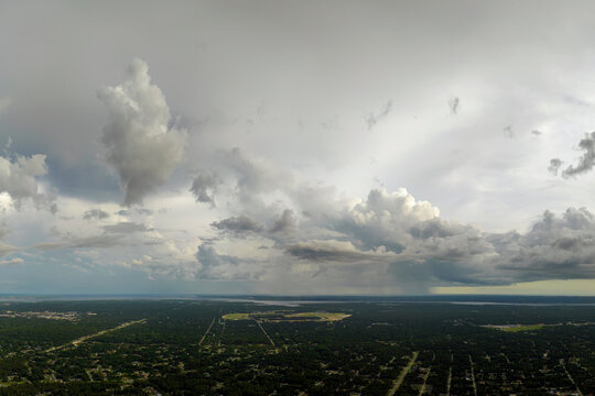 Tropical thunderstorm precipitation falling down on Florida town. Rain shower in summer
