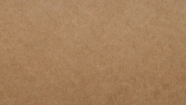 Smooth brown kraft paper texture with natural fiber pattern as a neutral design background