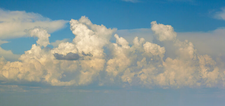 Rain clouds forming on blue Florida sky. Colorful summer skyscape