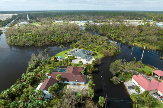 Surrounded by hurricane Ian rainfall flood waters homes in Florida residential area. Aftermath of natural disaster