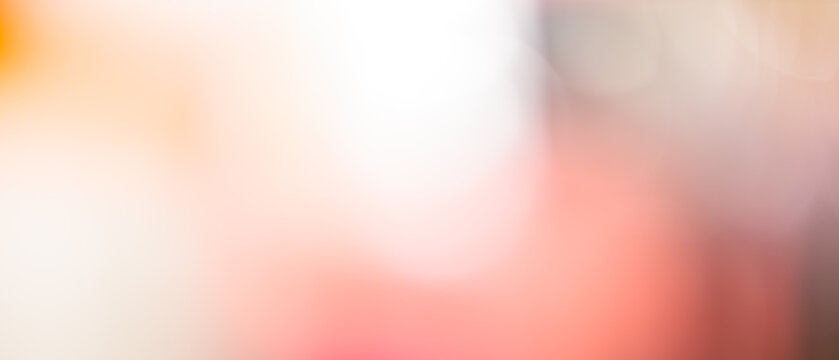 Soft pastel coral and cream abstract background with gentle blurred gradient and diffused light