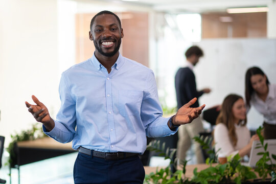 African american businessman smiling welcoming in office