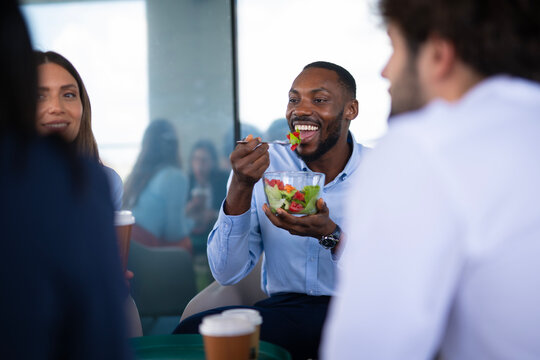 Diverse business team enjoying healthy lunch break together