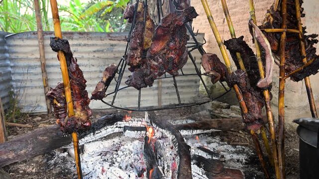 Traditional meat barbecue cooking over open fire