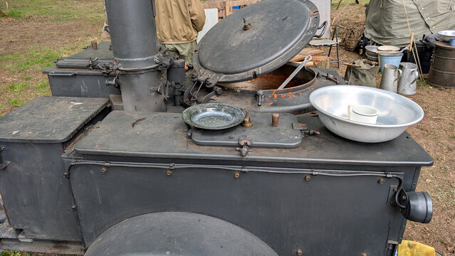 istoric military field kitchen with catering equipment and tableware. 