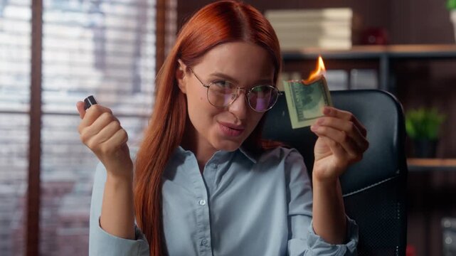 Close up smiling Caucasian business woman burning money banknote with fire fooling around having fun in office happy businesswoman smile burn cash dollar with flame in company female girl investor