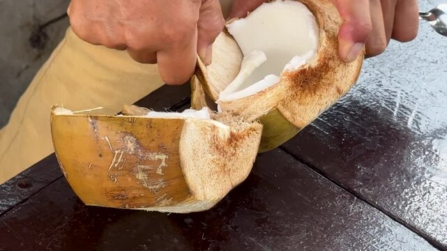 Removing Coconut Meat from a Coconut