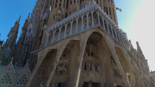 Street view around the downtown and the cathedral sagrada familia of the capitol city Barcelona, on a sunny spring day. With view from top of a bus