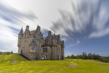 Obraz premium Long exposure of Glengorm Castle at sunset, Isle of Mull, Scotland
