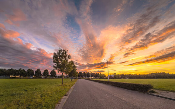 Spectacular Sunset Sky Over Street and Park, Assen, Netherlands