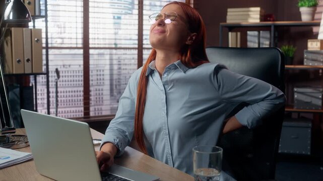 Bad feeling Caucasian business woman working with laptop suffering lower back spine discomfort ache pain stressed businesswoman female girl suffer with uncomfortable sitting executive with backache