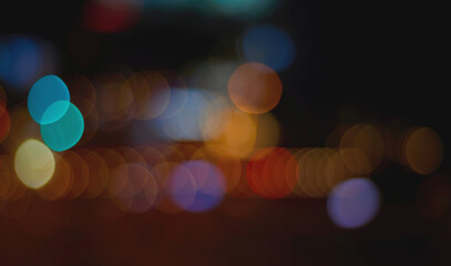 Teal blue orange bokeh overlay on dark night background for photo editing © Preethiloki