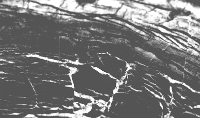 Obraz premium High contrast black marble surface texture with white vein and crack detail