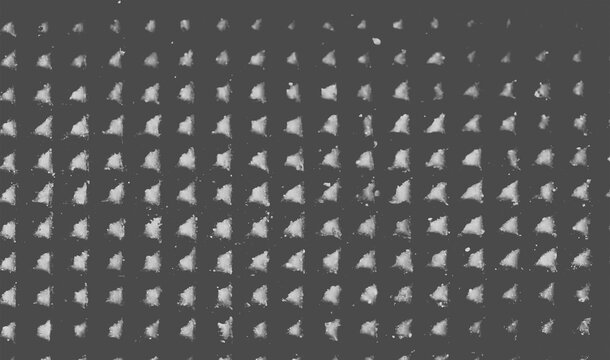 Black background with repeating white triangular powder splash stamp pattern